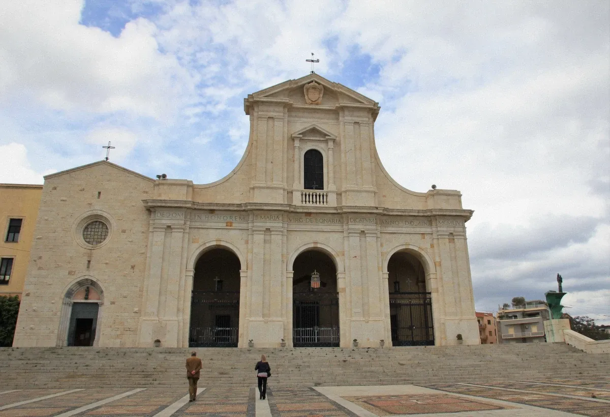 The Bonaria basilica on its hill above Cagliari's port, seen from the water on a boat tour approach
