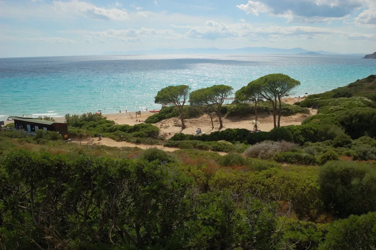 Cala Mari Pintau turquoise cove on the Sardinian coast east of Cagliari, destination of the full-day sailing trip
