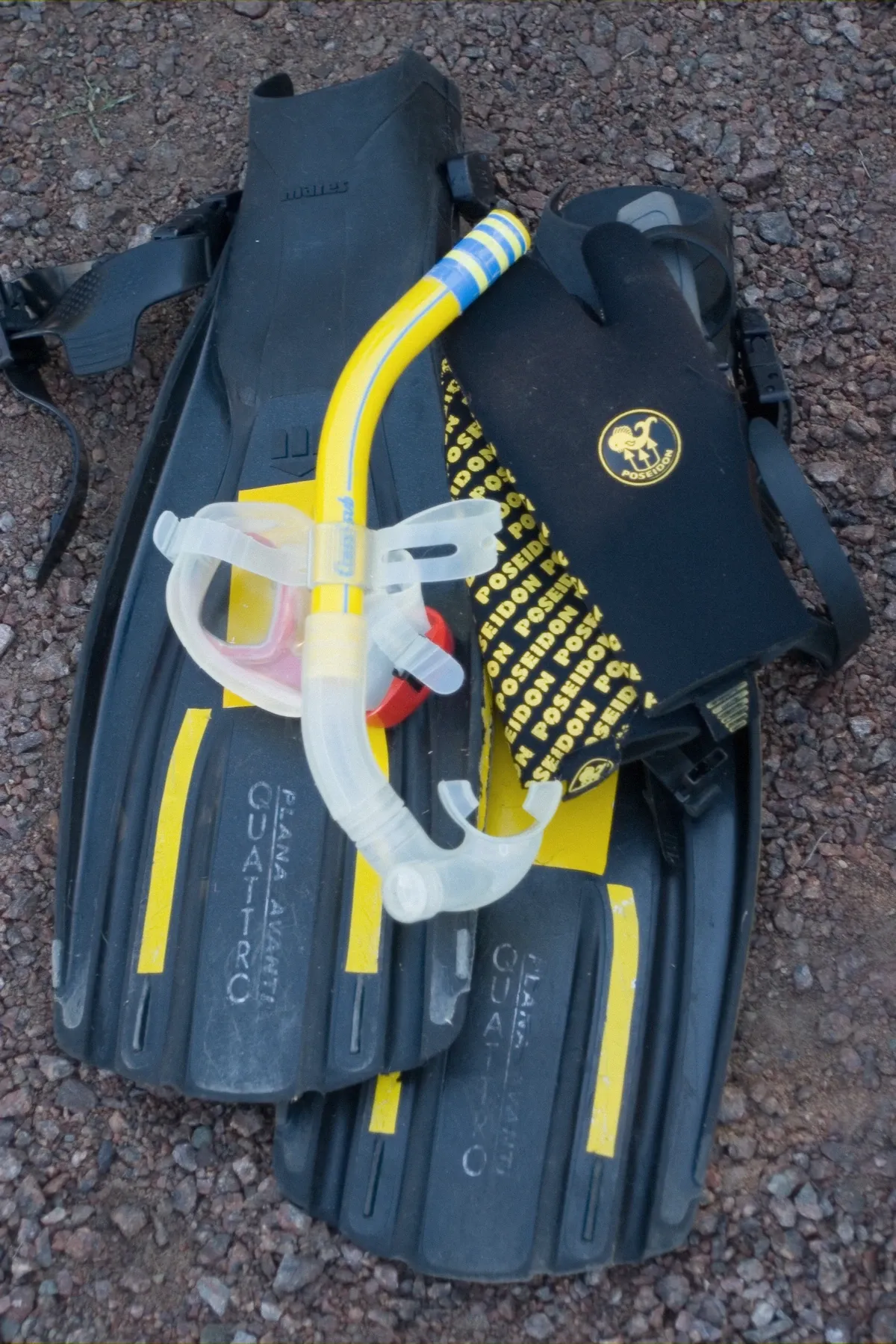 Snorkel mask and equipment laid out, the gear the Cagliari boat tours provide on board